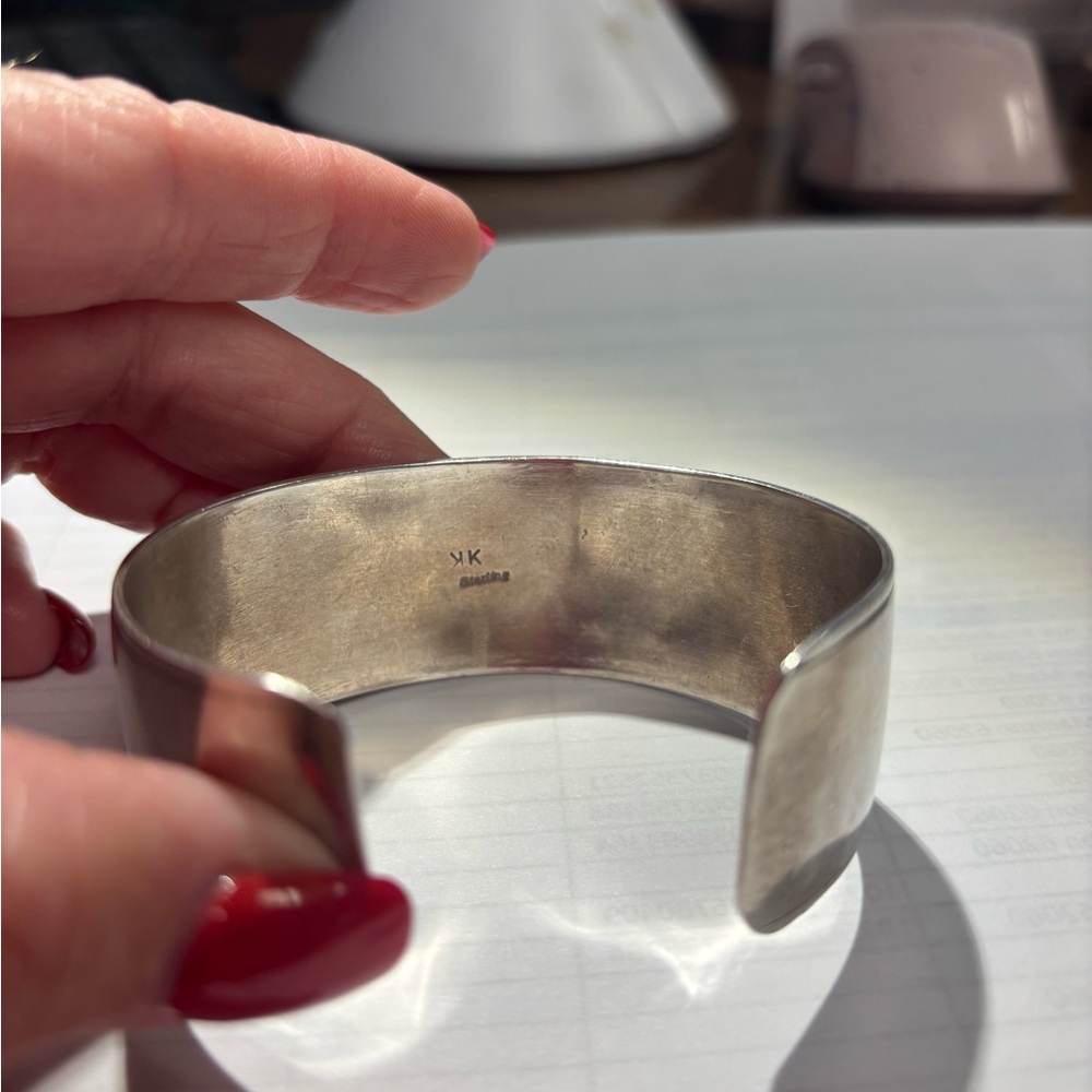 Jacob Kane storytelling pictograph gold and silver cuff.